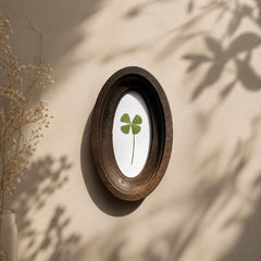 Four-leaf clover in oval frame, pressed clover, botanical decor