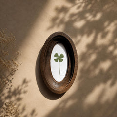 Four-leaf clover in oval frame, pressed clover, botanical decor