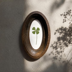 Four-leaf clover in oval frame, pressed clover, botanical decor
